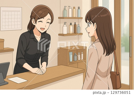 サロンの受付で笑顔でお客様を見送る女性スタッフ 129736051