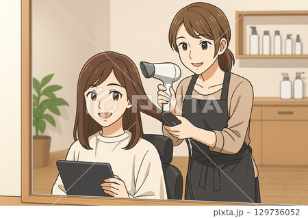 美容室でスタイリストがドライヤーを使い髪を乾かす仕上げの時間 129736052
