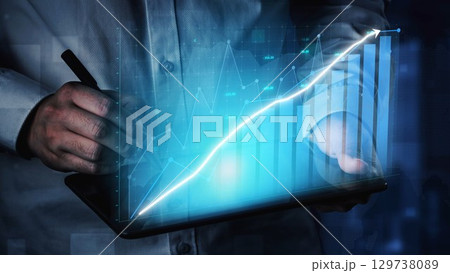 Businessperson Using Tablet to Analyze Financial Data with Graphs and Charts for Growth Strategy Visualization in Modern Office Environment Copula 129738089