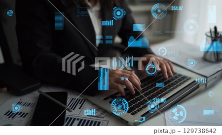 Professional Businessman Analyzing Data and Statistics on Laptop with Digital Graphs and Charts in Modern Office Environment xenic 129738642