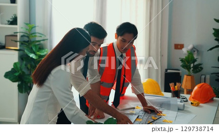 Top view of engineer hold laptop while explain idea to architect. Alimentation. 129738714