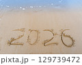 2026 numbers written in the sandy beach 129739472