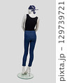 Full-length female mannequin skinny jeans, T-shirt and bandana on light gray background, back view. 129739721