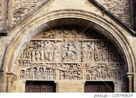 Stone carvings of the entrance of Abbey Church of Sainte-Foy, Conques, France, on the St. James Way Stone carvings of the entrance of Abbey Church of Sainte-Foy, Conques, France, on the St. James Way 129740624