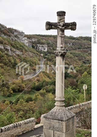Scenic view of Rocamadour, France with a stone cross overlooking the valley Scenic view of Rocamadour, France with a stone cross overlooking the valley 129740679
