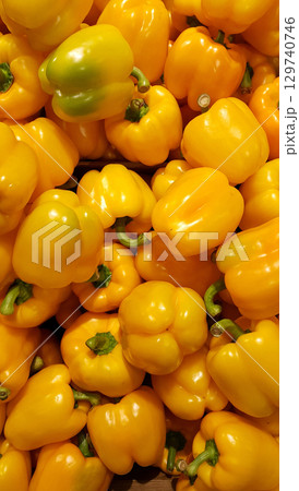 Yellow sweet peppers. Yellow Bell Peppers at the farmers market. Natural food background. 129740746