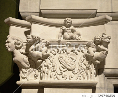 Intricate stone carvings of cherubs and mythical creatures at Chambord Castle in France Intricate stone carvings of cherubs and mythical creatures at Chambord Castle in France 129740839