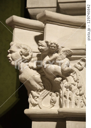 Intricate stone carvings of cherubs and mythical creatures at Chambord Castle in France 129740842