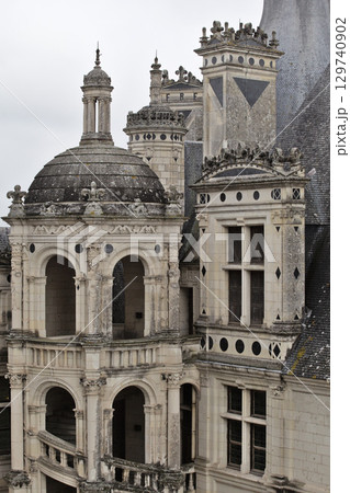 Chambord castle with intricate details in France's Loire Valley during a cloudy day Chambord castle with intricate details in France's Loire Valley during a cloudy day 129740902
