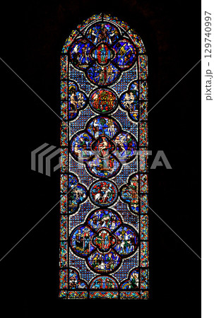 Stained glass window depicting biblical scenes at Notre-Dame de Chartres Cathedral in France 129740997