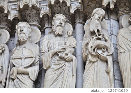 Sculptural details at Notre-Dame de Chartres Cathedral in France showcasing intricate stone carvings 129741029