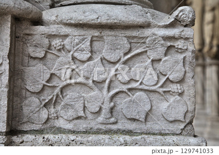 Intricate stone carvings on the facade of Notre-Dame de Chartres Cathedral in France Intricate stone carvings on the facade of Notre-Dame de Chartres Cathedral in France 129741033