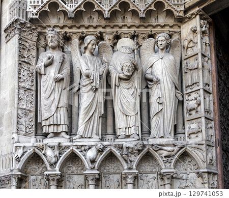 Sculptures of biblical figures adorning Notre Dame Cathedral in Paris, France 129741053