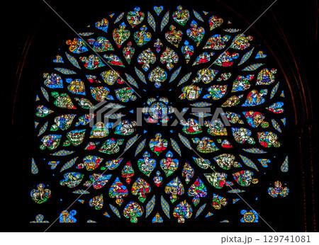 Stained glass rose window of Sainte-Chapelle, vibrant colors and intricate designs, interior 129741081