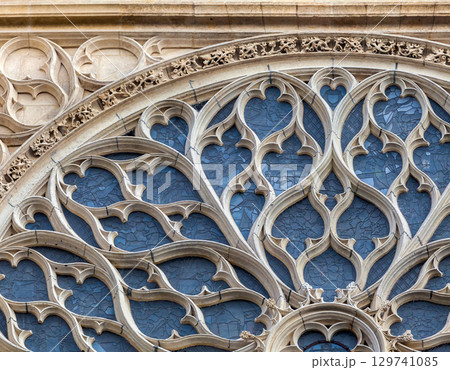 Intricate stained glass window of Sainte-Chapelle in Paris, Gothic architecture, exterior Intricate stained glass window of Sainte-Chapelle in Paris, Gothic architecture, exterior 129741085