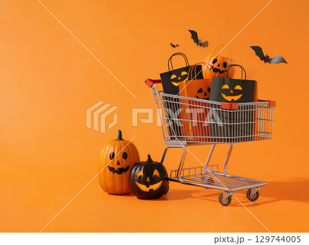 Halloween shopping cart full of festive pumpkins and themed bags with bats flying on bright orange 3D background 129744005