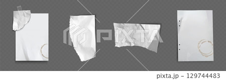 Ripped paper pieces with coffee stains and tape 129744483