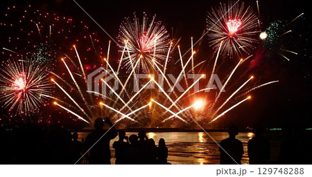 Colorful vibrant Firework celebrate anniversary happy new year 2024, 4th of july holiday festival. colorful firework in night time to celebrate national holiday. countdown new year party background 129748288