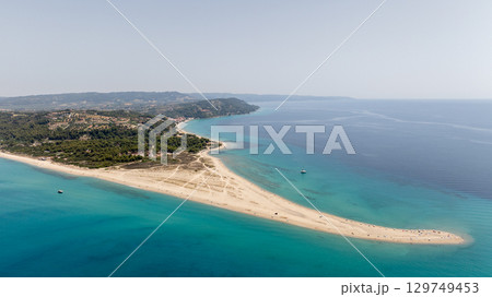 Breathtaking aerial view of Possidi cape in Kassandra, Halkidiki, Greece, showcasing the beautiful sandy beach, turquoise Aegean sea, and lush greenery 129749453