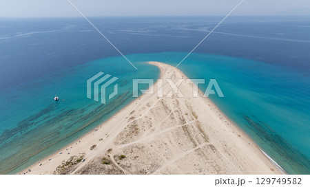 Aerial view of Possidi cape, Kassandra, Halkidiki, Greece, showcasing the meeting of white sand and turquoise water 129749582