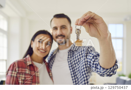 Happy Family Holding Keys to New Home Happy Family Holding Keys to New Home 129750437