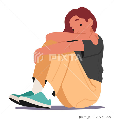 Sad frustrated teenage girl hugging knees with hands sitting on floor isolated on white background 129750909