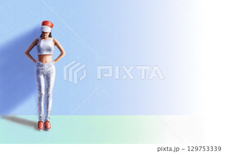 a woman standing against a wall a woman standing against a wall 129753339