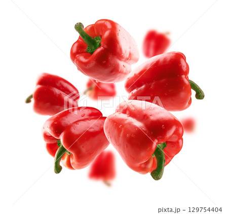 Red paprika levitates on a white background Red paprika levitates on a white background 129754404
