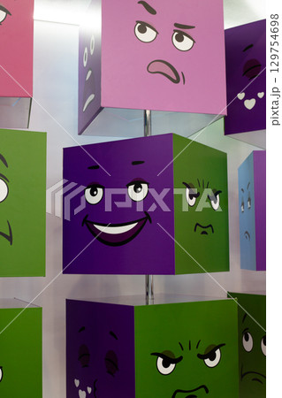 Colorful rotating cubes with expressive faces, perfect for teaching kids emotions. Each side features a new emotion, ideal for educational games, child development, and emotional learning activities Colorful rotating cubes with expressive faces, perfect for teaching kids emotions. Each side features a new emotion, ideal for educational games, child development, and emotional learning activities 129754698