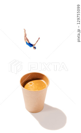Creative composition. Diver in blue swimsuit falling into paper coffee cup on white background. 129755099