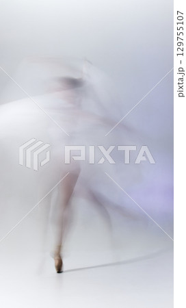 Abstract motion blur of ballerina dancing in flowing movement Abstract motion blur of ballerina dancing in flowing movement 129755107