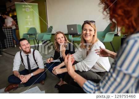 Team brainstorming in modern office, discussing marketing strategy. Team brainstorming in modern office, discussing marketing strategy. 129755460
