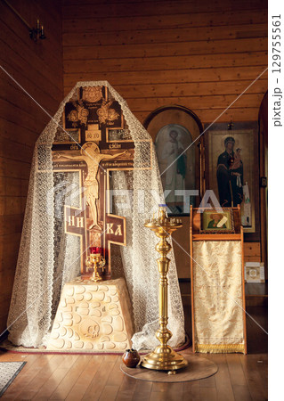 Large cross with the crucifixion of Jesus Christ in Orthodox Church 129755561
