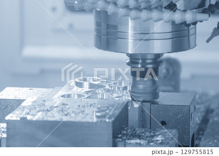 The CNC milling machine rough cut the aluminum parts with face mill tool  in the blue tone scene 129755815