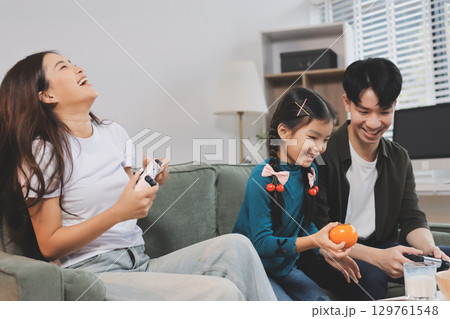 Family spends their free time together Family spends their free time together 129761548