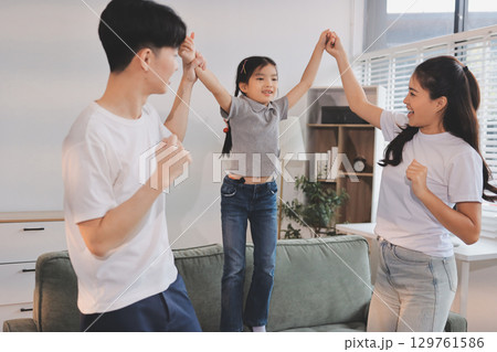 Family spends their free time together Family spends their free time together 129761586
