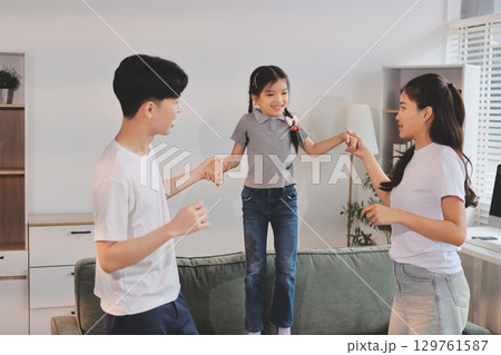 Family spends their free time together Family spends their free time together 129761587