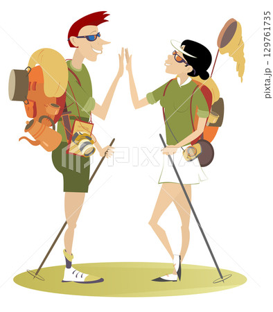Travel. Cheerfulness travelers. Hiking man and woman. Man and woman with tourist equipment on the backs congratulate one another with a good travel 129761735