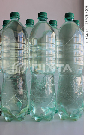 Transparent bottles of drinking water are stored in case of a water supply shutdown  129762076