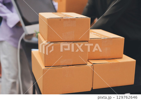 Portrait of Starting small businesses SME owners, two Asian woman check online orders Selling products working with boxs freelance work at home office, sme business online small medium enterprise Portrait of Starting small businesses SME owners, two Asian woman check online orders Selling products working with boxs freelance work at home office, sme business online small medium enterprise 129762646