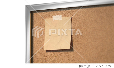 Blank craft paper note taped cork-board mockup, depth of field Blank craft paper note taped cork-board mockup, depth of field 129762729