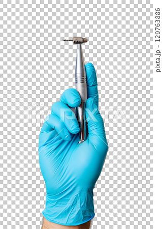 Dentist's gloved hand holding dental drill, oral surgery tool isolated on transparent background 129763886