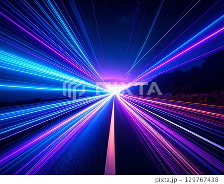 An abstract background of vibrant blue rays bursts forth with glowing energy and a bright flash of light 129767438