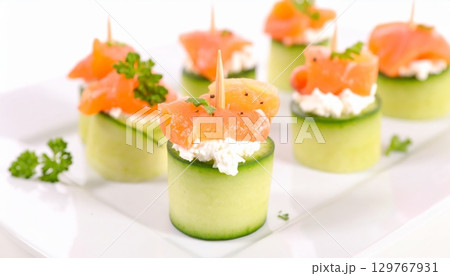 Fresh seafood salads: delicious salmon and shrimp appetizers with fresh vegetables 129767931