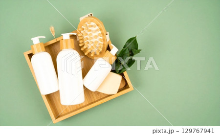 Unhealthy smoking addiction and danger from a red box cigarette pack next to a paint roller and brush Unhealthy smoking addiction and danger from a red box cigarette pack next to a paint roller and brush 129767941