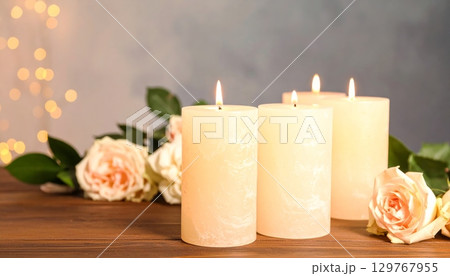 Rose petals and burning candles create a relaxing aromatherapy decoration 129767955