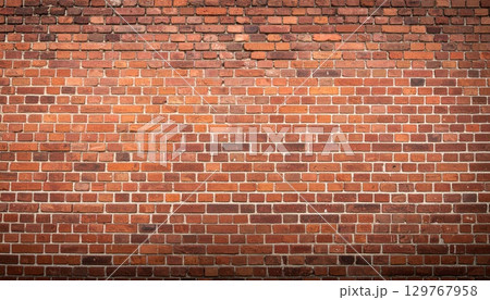 An old red brick wall with a textured pattern of cement and stone blocks An old red brick wall with a textured pattern of cement and stone blocks 129767958