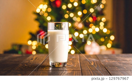 Glass of cold, fresh milk on a wooden table 129767967