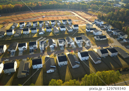 View from above of densely built residential houses under construction in south Carolina residential area. American dream homes as example of real estate development in US suburbs 129769340