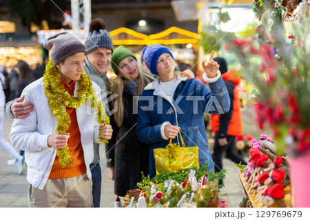 Portrait of a happy European family an Christmas fair Portrait of a happy European family an Christmas fair 129769679